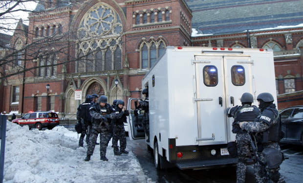 SWAT team officers arrive at a building at Harvard University in Cambridge, Massachusetts on Monday - AP SWAT team officers arrive at a building at Harvard University in Cambridge, Massachusetts on Monday - AP